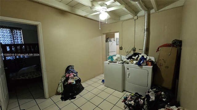 laundry room featuring separate washer and dryer, ceiling fan, and light tile patterned floors