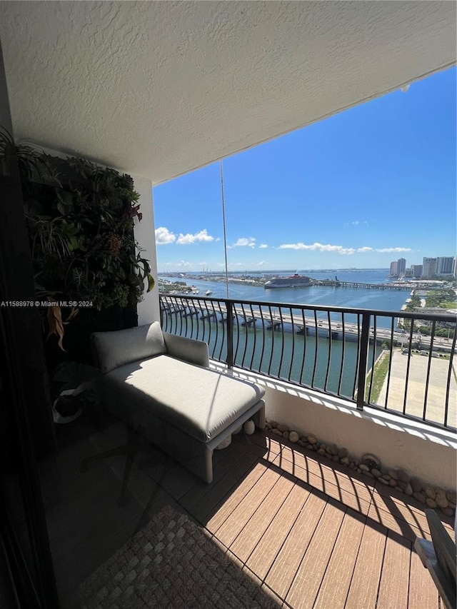 balcony featuring a water view