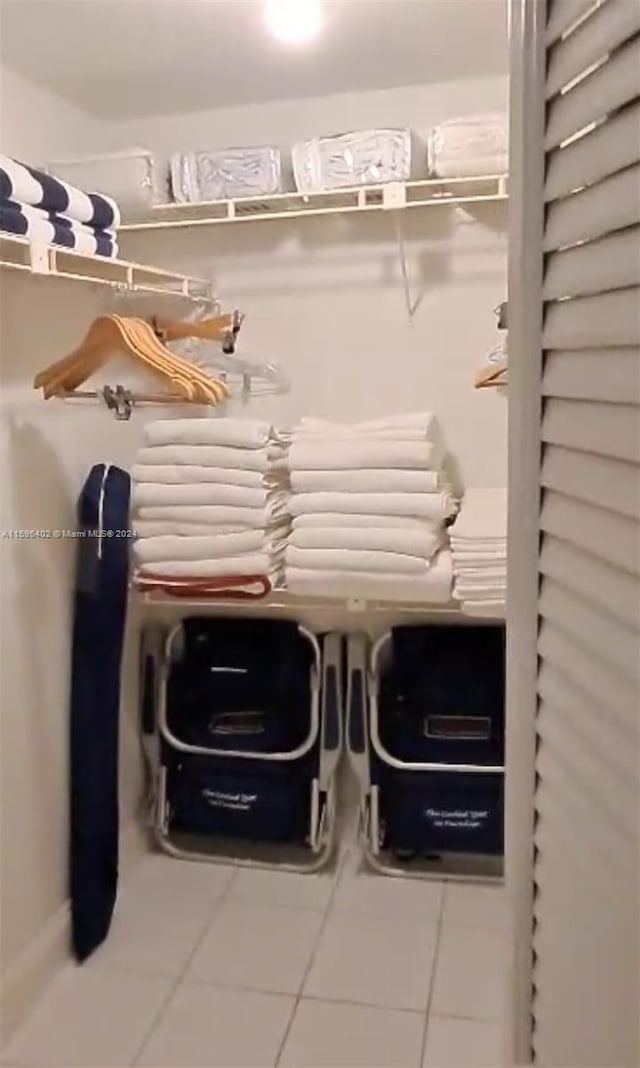 spacious closet with tile floors