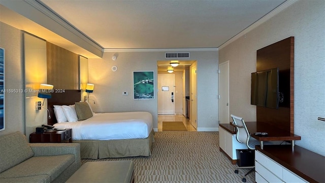 bedroom featuring ornamental molding and light carpet