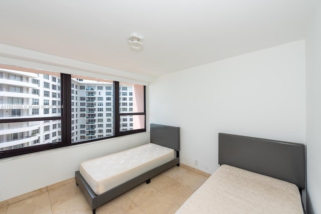 bedroom featuring light tile patterned flooring