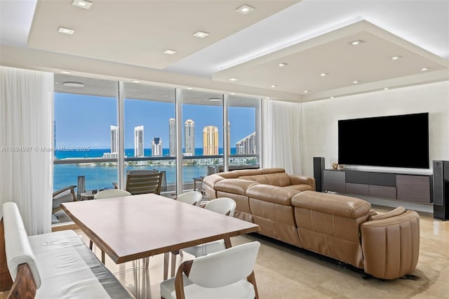 living room featuring a water view and floor to ceiling windows