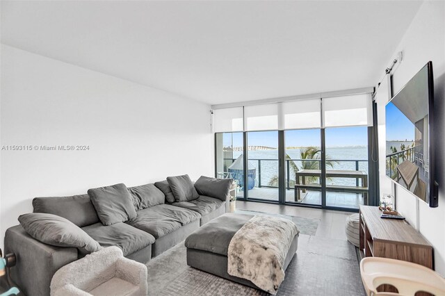 living room featuring a wall of windows