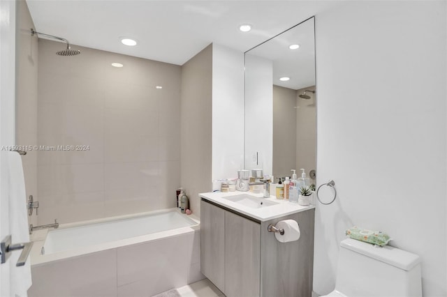 full bathroom with vanity, toilet, and tiled shower / bath