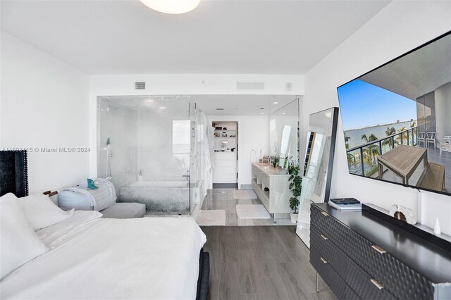 bedroom with dark hardwood / wood-style flooring