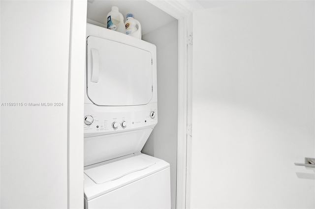 laundry area with stacked washer and clothes dryer