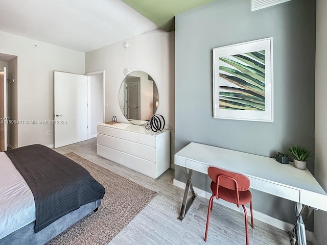 bedroom featuring light hardwood / wood-style flooring