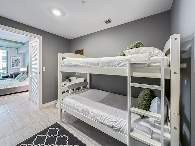 bedroom with hardwood / wood-style flooring