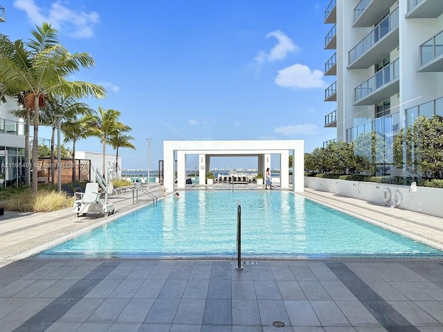 view of swimming pool with a patio