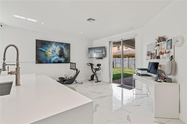 office featuring marble finish floor, a sink, visible vents, and recessed lighting