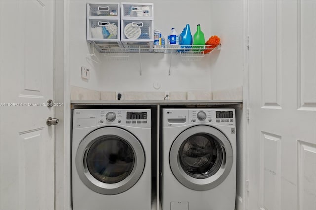 laundry area with washing machine and dryer and laundry area