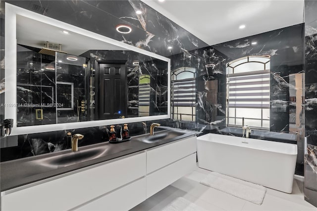 bathroom featuring a shower, a freestanding tub, a sink, and double vanity