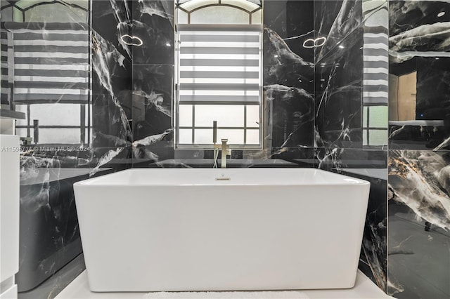 bathroom with tile walls