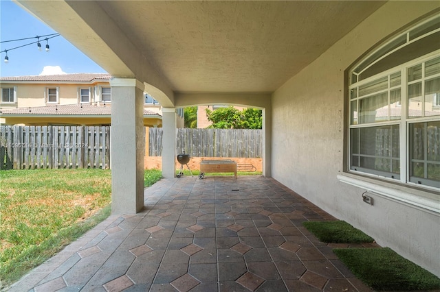 view of patio featuring fence