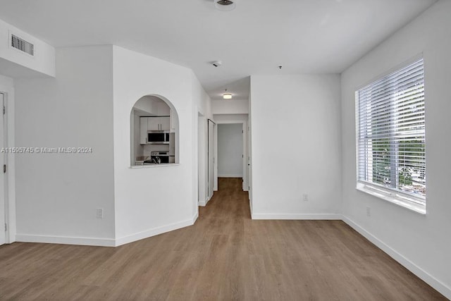 empty room featuring wood-type flooring