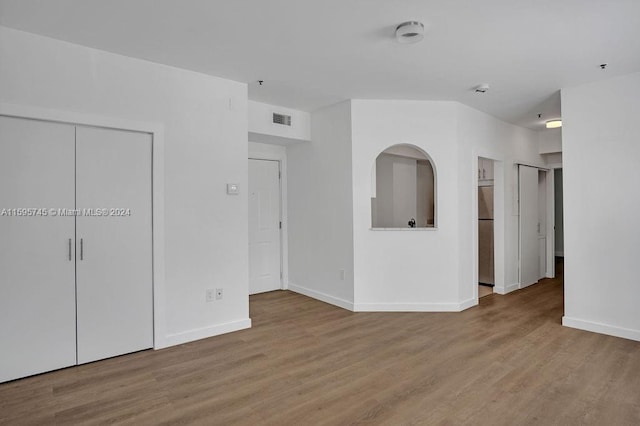 spare room featuring hardwood / wood-style flooring