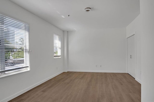 spare room featuring hardwood / wood-style flooring