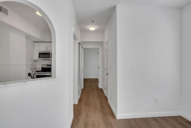 corridor featuring light wood-type flooring