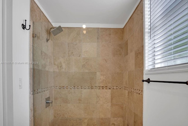 bathroom with tiled shower