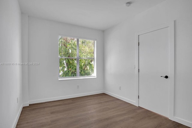 spare room with hardwood / wood-style floors