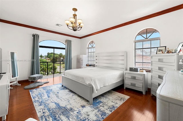 bedroom with dark wood-type flooring, crown molding, a notable chandelier, and access to exterior