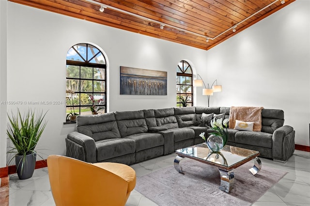 living room with wood ceiling and vaulted ceiling