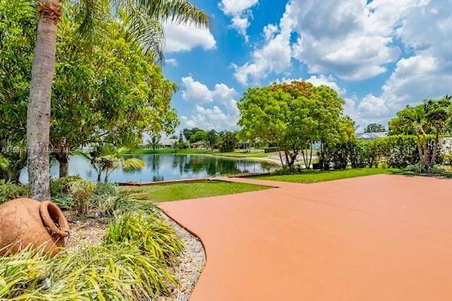 surrounding community featuring a water view