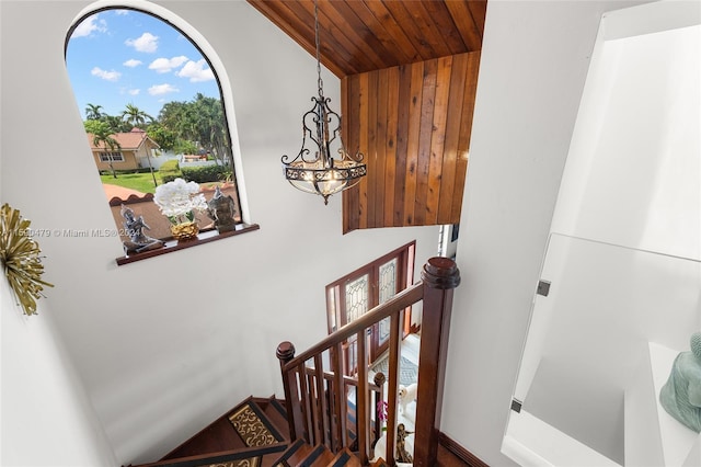 stairs featuring wooden ceiling