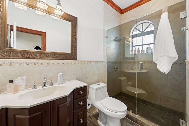 bathroom featuring a shower with door, vanity, toilet, and tile walls