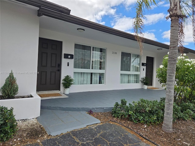 property entrance featuring covered porch