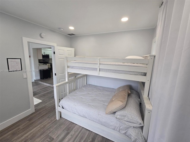 bedroom featuring dark hardwood / wood-style flooring