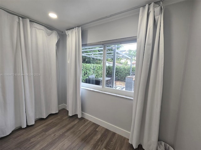 empty room with dark hardwood / wood-style floors