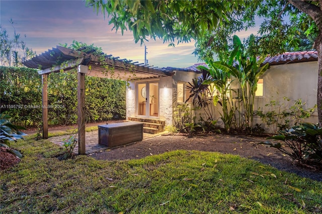 yard at dusk with a pergola