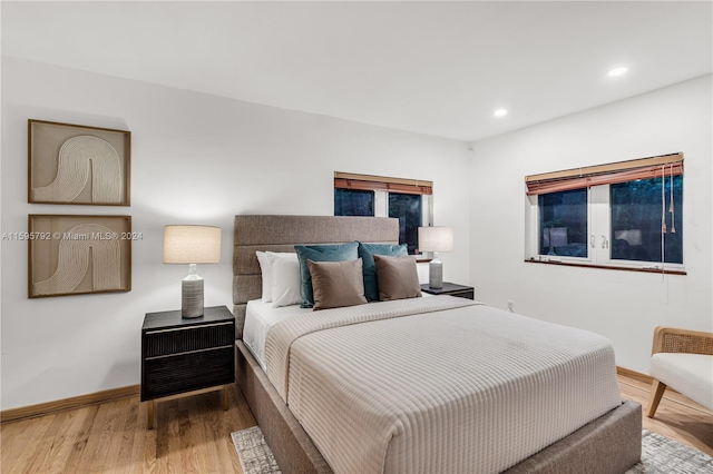 bedroom with hardwood / wood-style floors