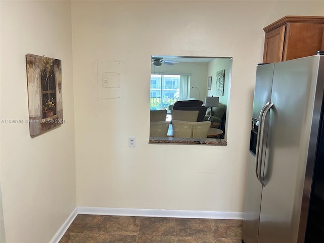 kitchen featuring ceiling fan and stainless steel fridge