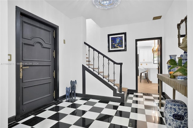 foyer entrance with dark hardwood / wood-style flooring