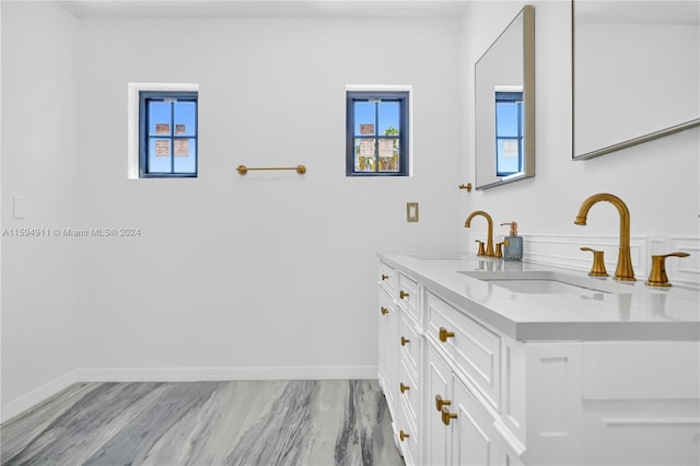 bathroom with hardwood / wood-style floors and vanity