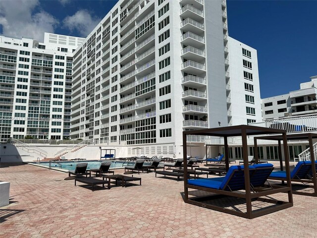 view of property featuring a community pool