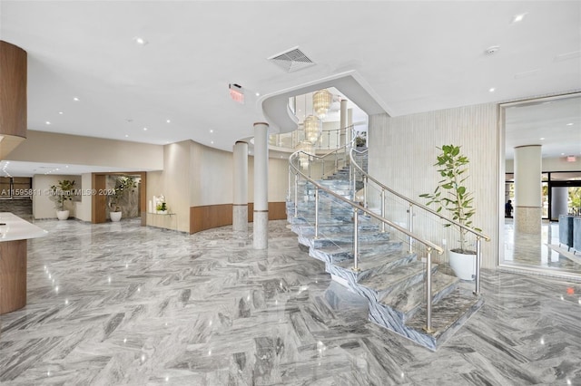 stairs featuring visible vents and a chandelier