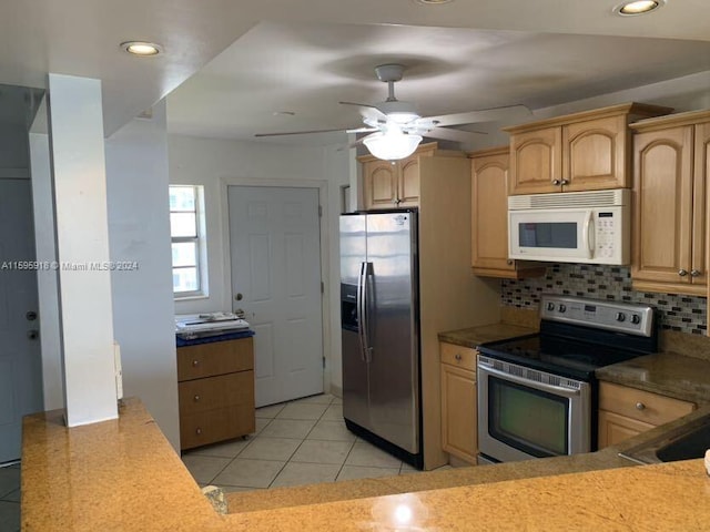 kitchen featuring light brown cabinets, light tile patterned floors, ceiling fan, stainless steel appliances, and backsplash