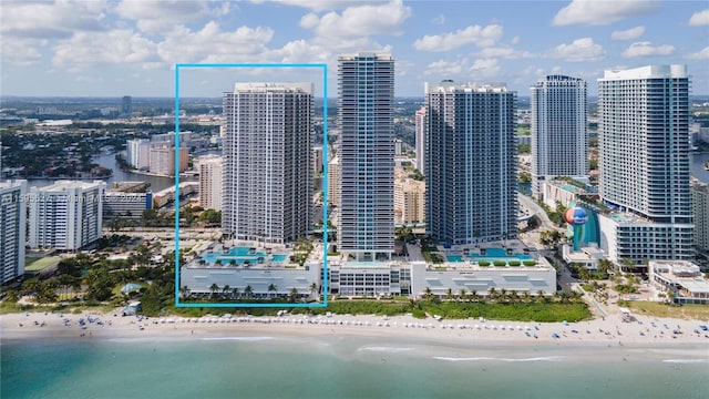 view of city featuring a view of the beach and a water view