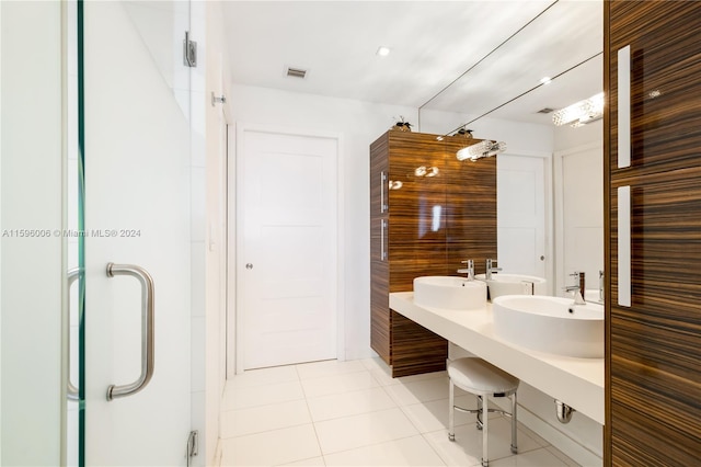 bathroom with double sink and tile floors