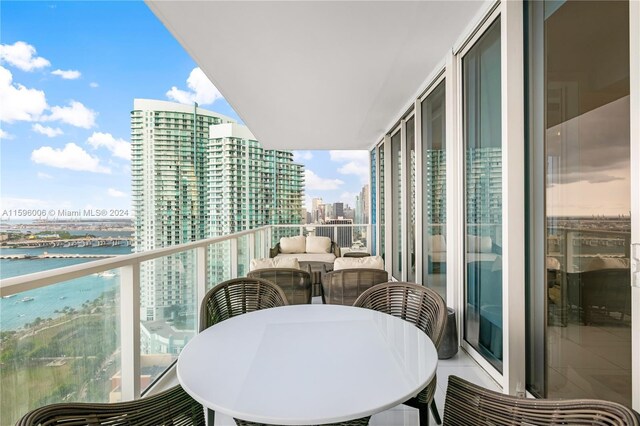 balcony featuring a water view