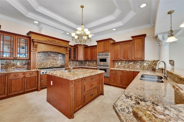 kitchen featuring decorative light fixtures, light stone counters, an inviting chandelier, and sink