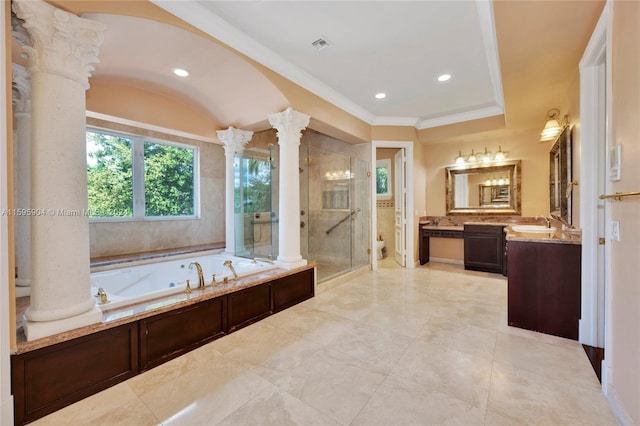 bathroom with ornate columns, independent shower and bath, crown molding, and vanity