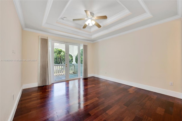 empty room featuring ornamental molding, french doors, dark hardwood / wood-style flooring, and ceiling fan