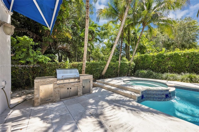 exterior space with area for grilling, grilling area, and a fenced in pool