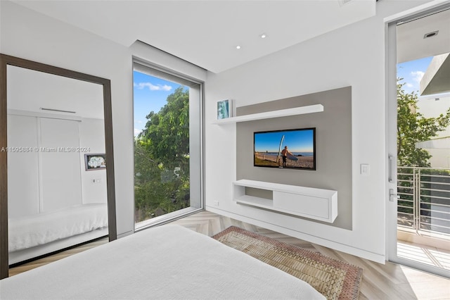 bedroom featuring light hardwood / wood-style floors and access to outside