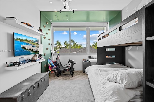 bedroom with light parquet floors