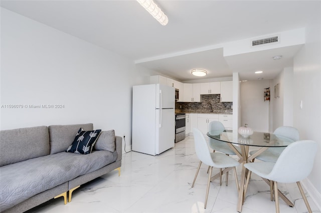 tiled dining room with sink